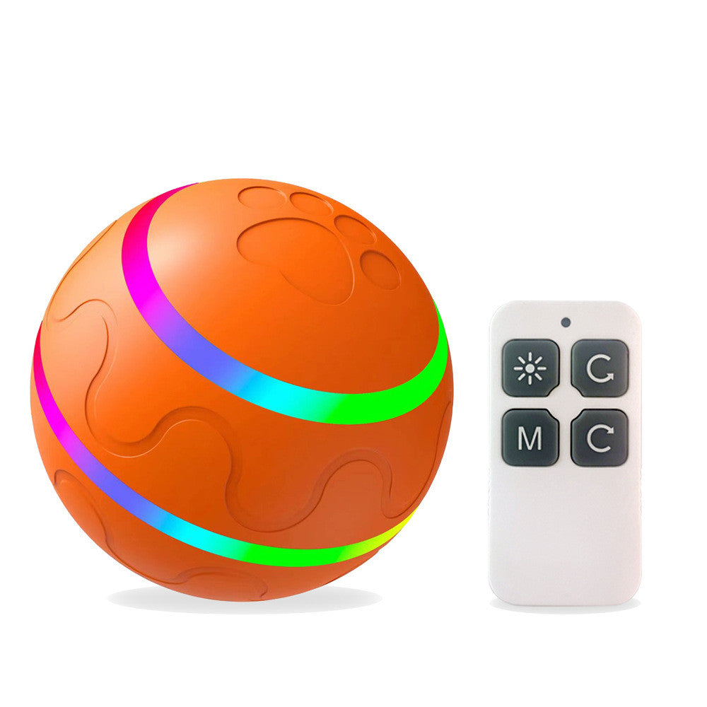 Orange ball with colorful bands and a remote control on a white background