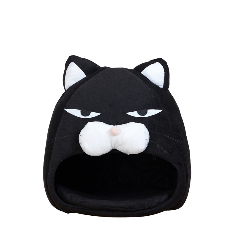 Black cat-shaped pet bed with white face and ears on a white background