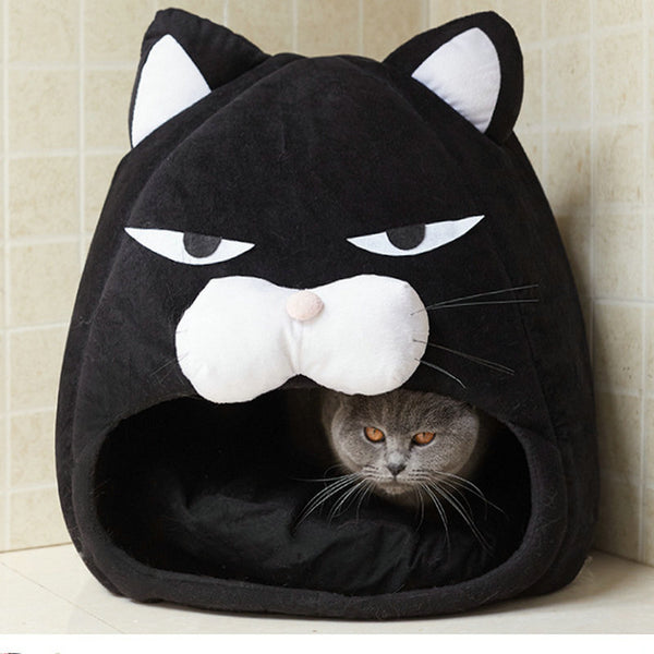 Black cat-shaped pet bed with a gray cat peeking out.