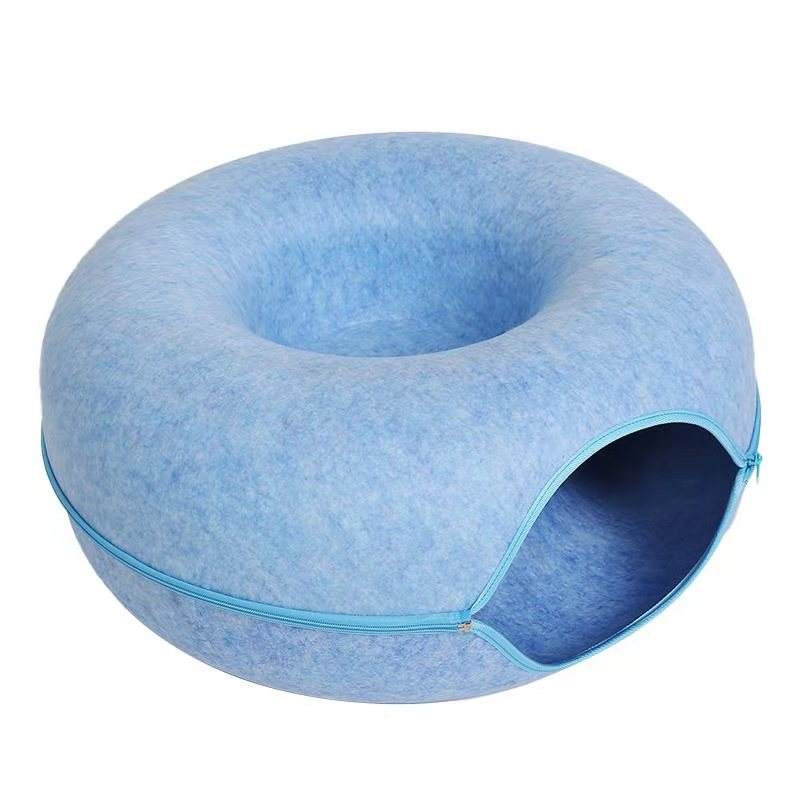 Blue pet bed with a circular design on a white background