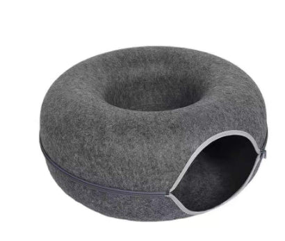Gray pet bed with a circular design on a white background