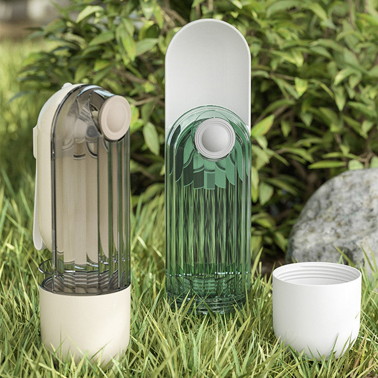 Three cylindrical devices on grass with a natural background
