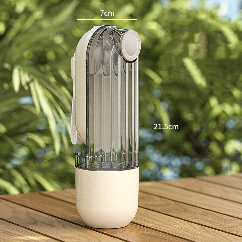Transparent spray bottle with white base on a wooden surface, measurement labels shown.